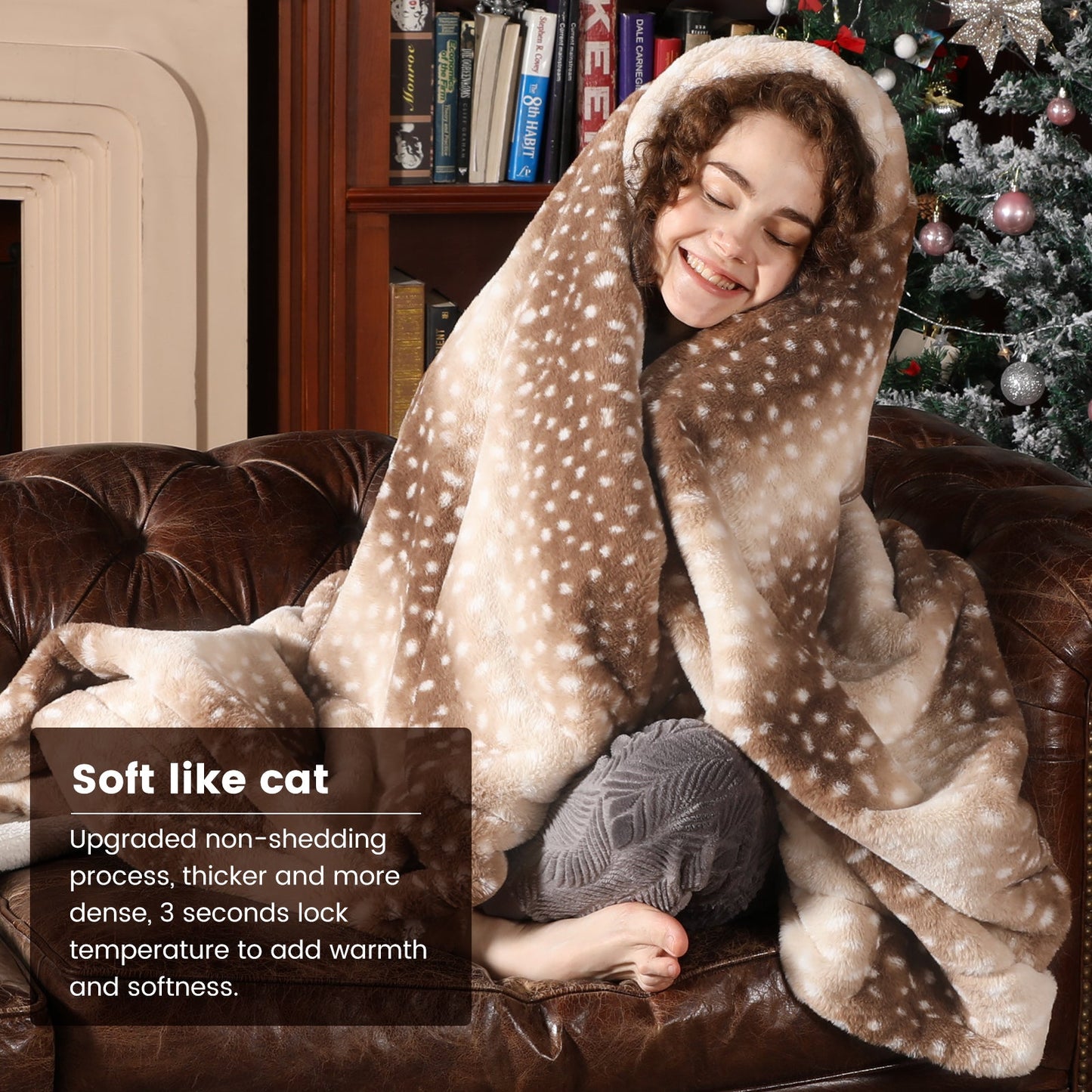 Person wrapped in a soft, plush blanket on a couch with a Christmas tree in the background