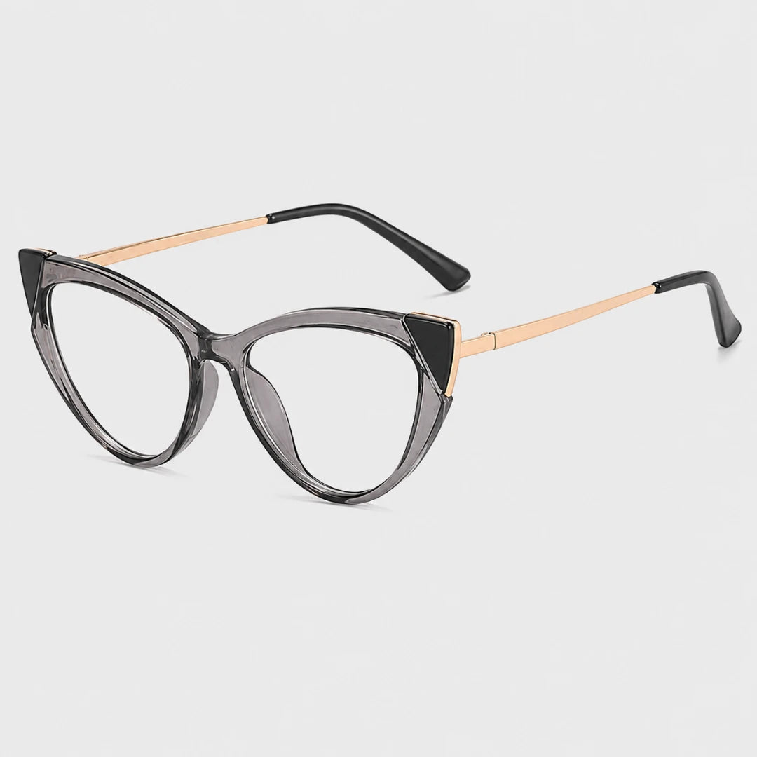 Josh & Tate - FelineFrame™ Blue Light Glasses - Cat-eye eyeglasses featuring a translucent dark gray acetate frame with gold metal accents at the hinge and temples, set against a light gray background.