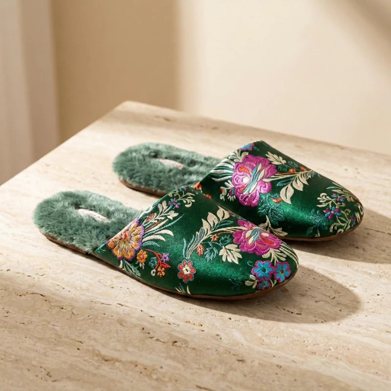 Josh & Tate - FloraStep™ Satin Fur-Lined Slipper - Green slippers with floral patterns on a wooden surface