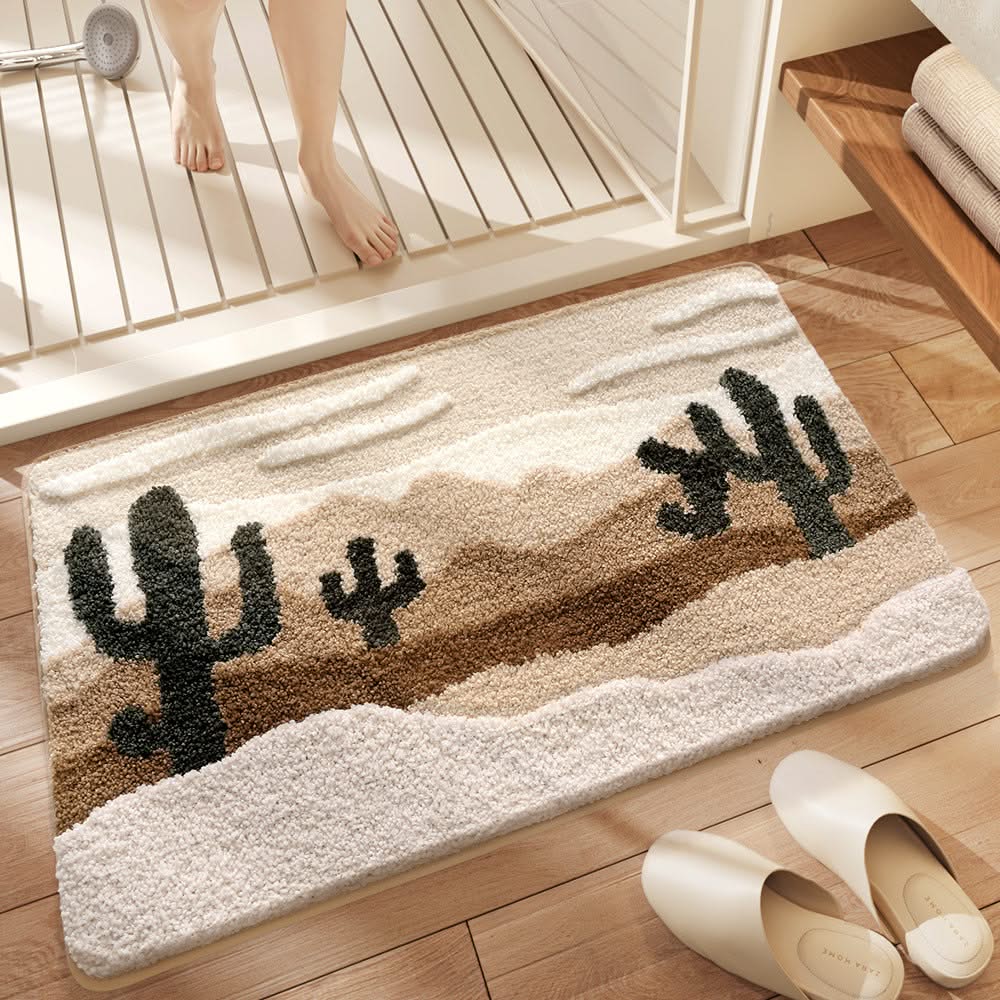 Decorative bath mat with cactus design on a wooden floor.