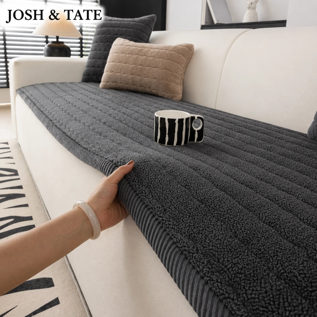Jopsh & Tate - FluffLayer™ Plush Sofa Pad - Gray sofa cover being adjusted on a white sofa with a cup on top, in a living room setting.