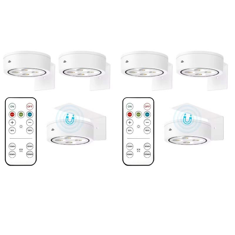 Set of six white undercabinet lights with remote controls on a white background