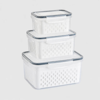 Josh & Tate - FreshBasket™ 3-in-1 Storage Set - Three nested clear plastic storage baskets with perforated white bases and transparent lids, shown on a light gray background.