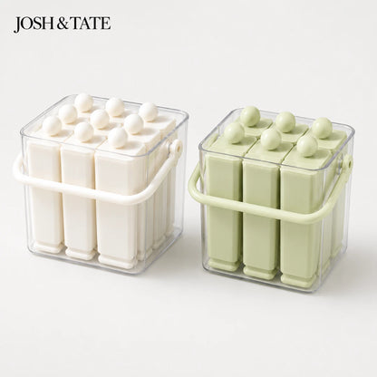 Josh & Tate - FrostPop™ 2-in-1 Popsicle Maker - Two containers of white and green wax melts with 'JOSH & TATE' branding on a white background.