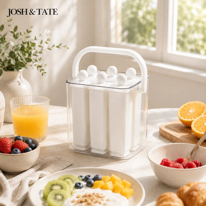 Josh & Tate - FrostPop™ 2-in-1 Popsicle Maker - White ice cream mold on a table with fruits and juice, featuring 'Josh & Tate' branding.