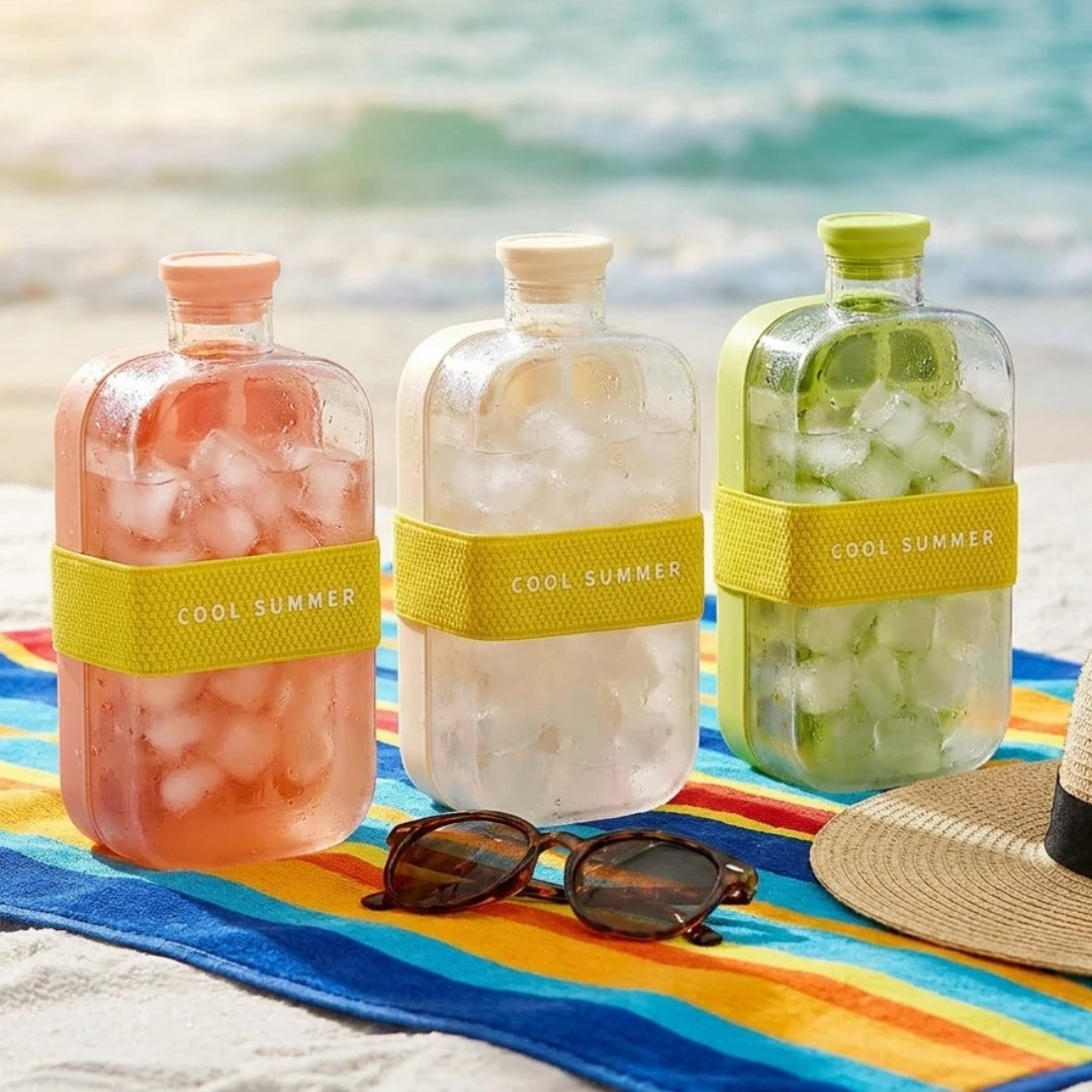 Josh & Tatte - FrostPour™ 2-in-1 Ice Cube Tray & Drinking Bottle - Three bottles with 'Cool Summer' labels on a beach setting with sunglasses and a hat.