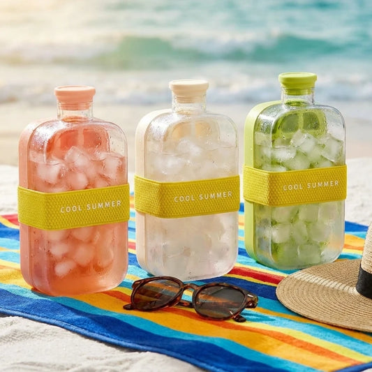 Josh & Tatte - FrostPour™ 2-in-1 Ice Cube Tray & Drinking Bottle - Three bottles with 'Cool Summer' labels on a beach setting with sunglasses and a hat.