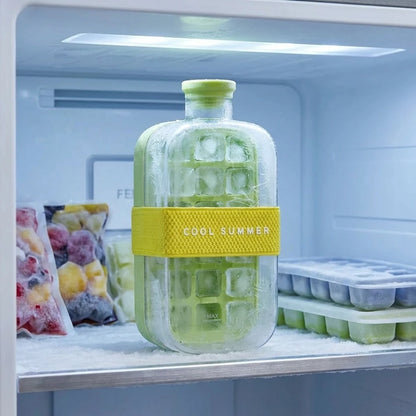 Josh & Tate - FrostPour™ 2-in-1 Ice Cube Tray & Drinking Bottle - Ice cube tray with green ice cubes inside a refrigerator