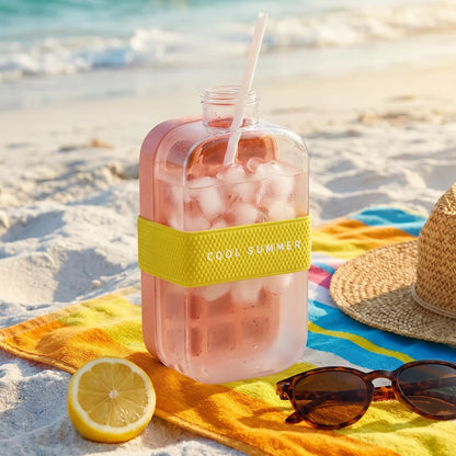 Josh & Tate - FrostPour™ 2-in-1 Ice Cube Tray & Drinking Bottle - Clear bottle with pink drink, lemon, sunglasses, and straw on a beach towel with 'Cool Summer' band.