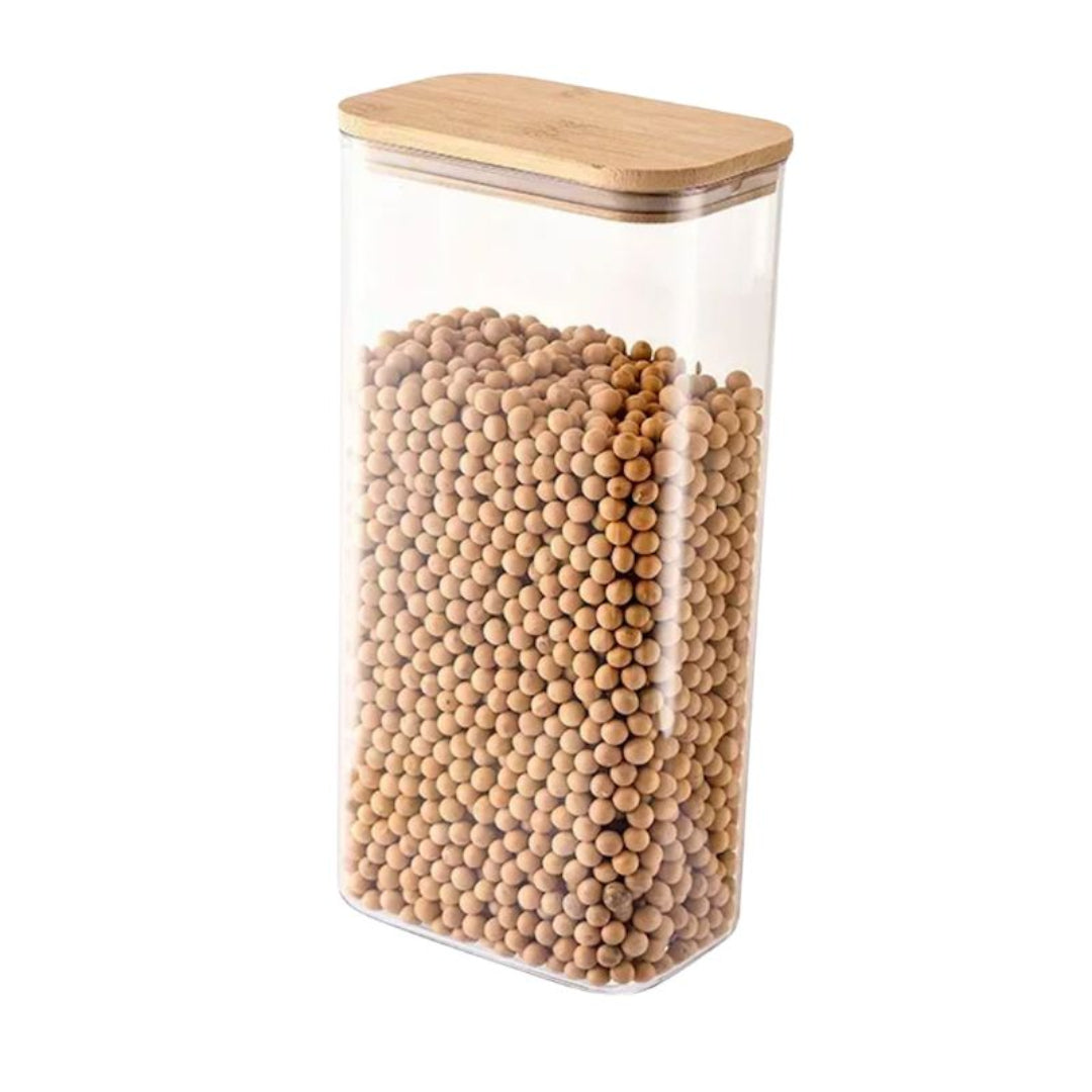 Clear storage jar with wooden lid filled with wooden beads on a white background