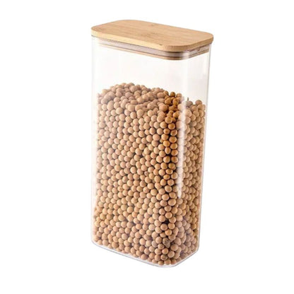Clear storage jar with wooden lid filled with wooden beads on a white background