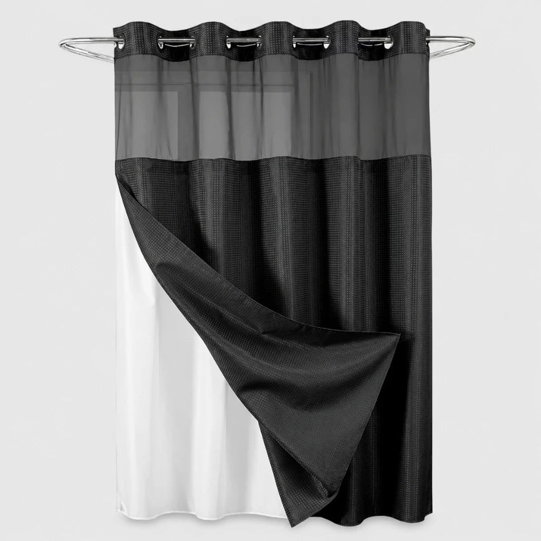 Josh & Tate - GlideCurtain™ No-Hook Shower Curtain - A black and white curtain panel hanging from a silver metal rod with grommets, shown against a light gray background.