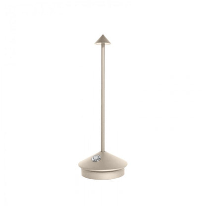 Beige toilet brush holder with a brush on a white background