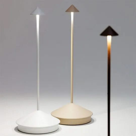 Three modern outdoor lamps with different shades of light on a gray background