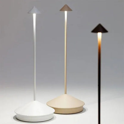 Three modern outdoor lamps with different shades of light on a gray background