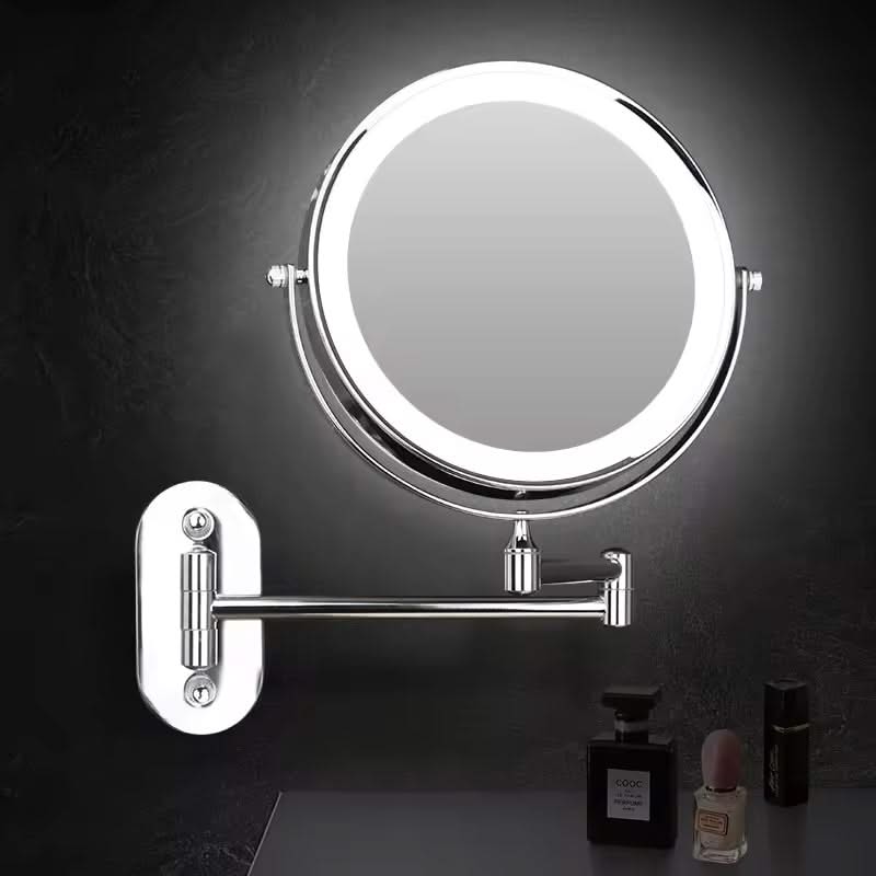 Wall-mounted makeup mirror with light on a dark background