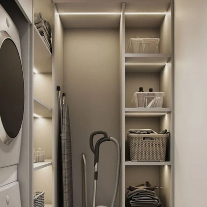 Josh & Tate - GlowMotion Motion Sensor Lamp - Modern laundry room with shelves, washing machine, and cleaning supplies.