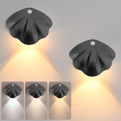 Set of four black wall lights with different color temperature settings on a gray background