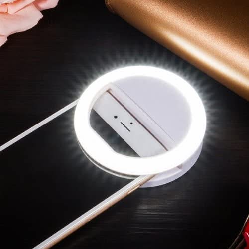 Smartphone with a ring light on a dark surface