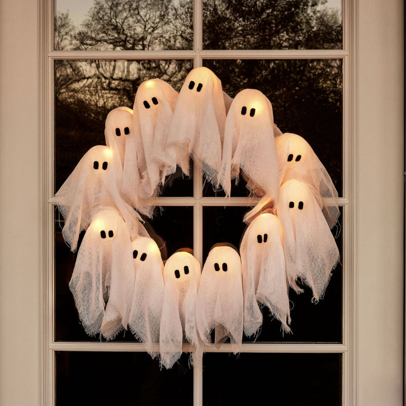 Halloween ghost decorations on a window
