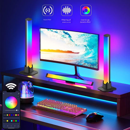Gaming setup with RGB lighting, monitor, keyboard, and mouse on a desk.