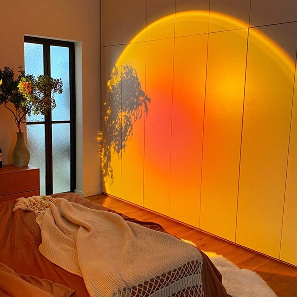 Room with a large wall-mounted light casting a warm glow on the wall.
