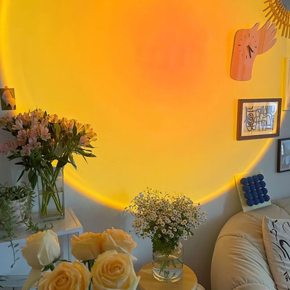 Living room with yellow walls, flowers, and decorative items.