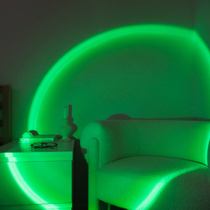 Green-lit room with a chair and table, glowing with a neon green light.