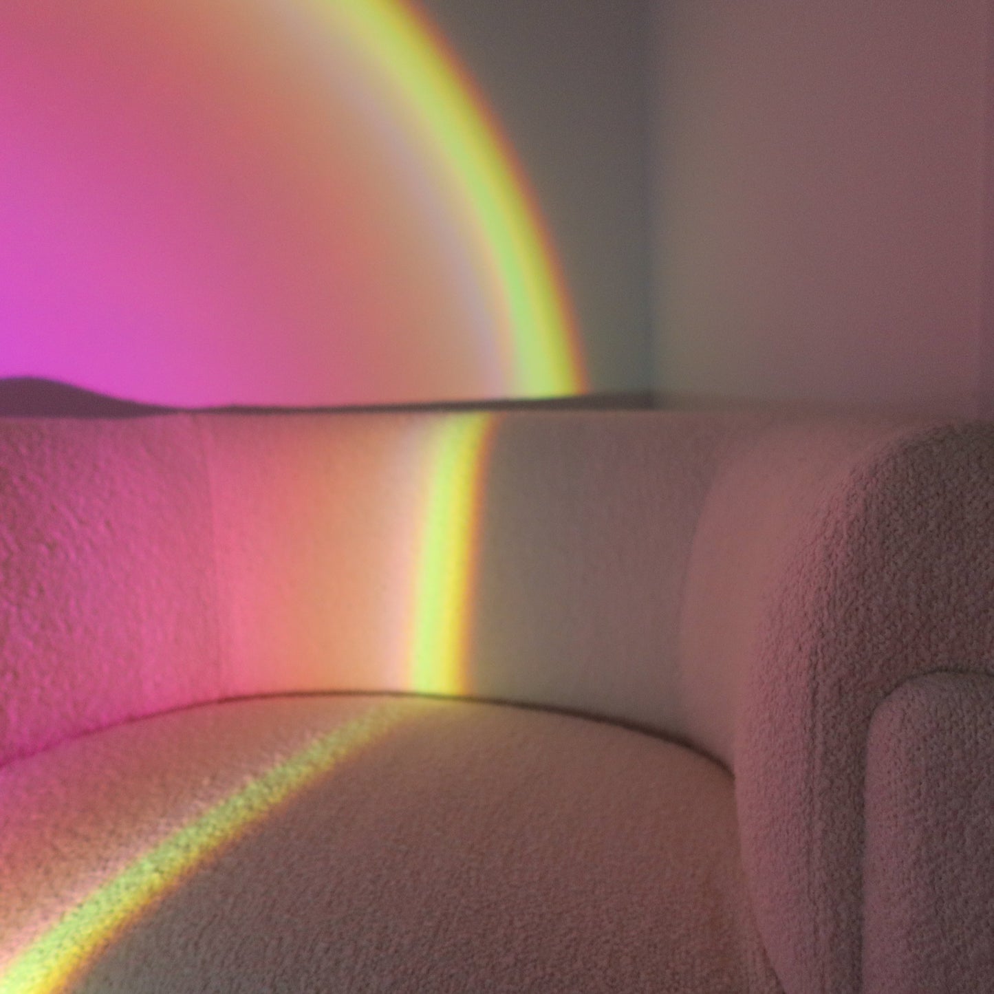 Multicolored rainbow light projected onto a textured surface