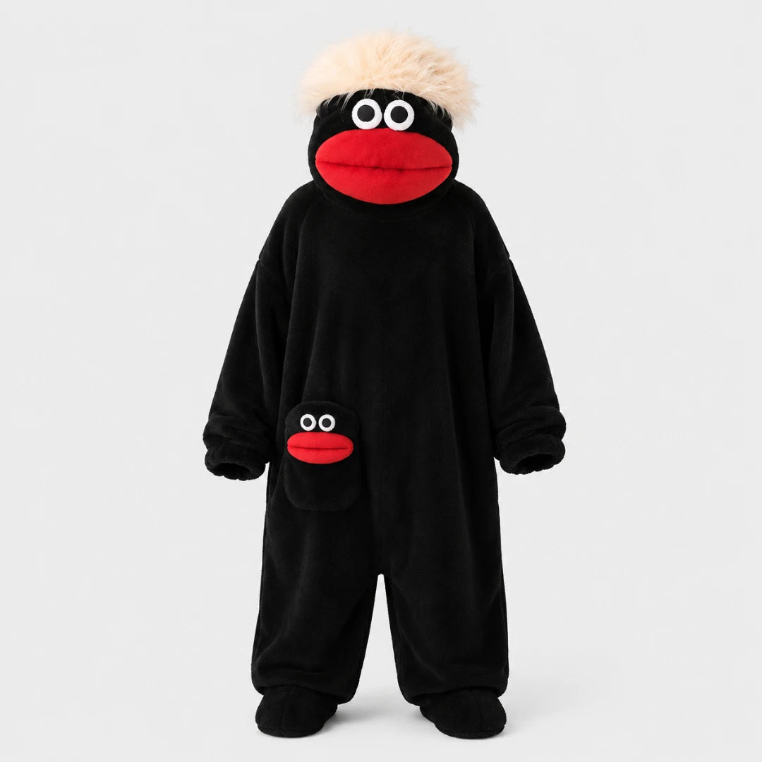 Josh & Tate - GoofSuit™ Big Mouth Monster Onesie - A black plush one-piece costume with a character face on the head and a matching face patch on the pocket, shown on a plain light gray studio background.