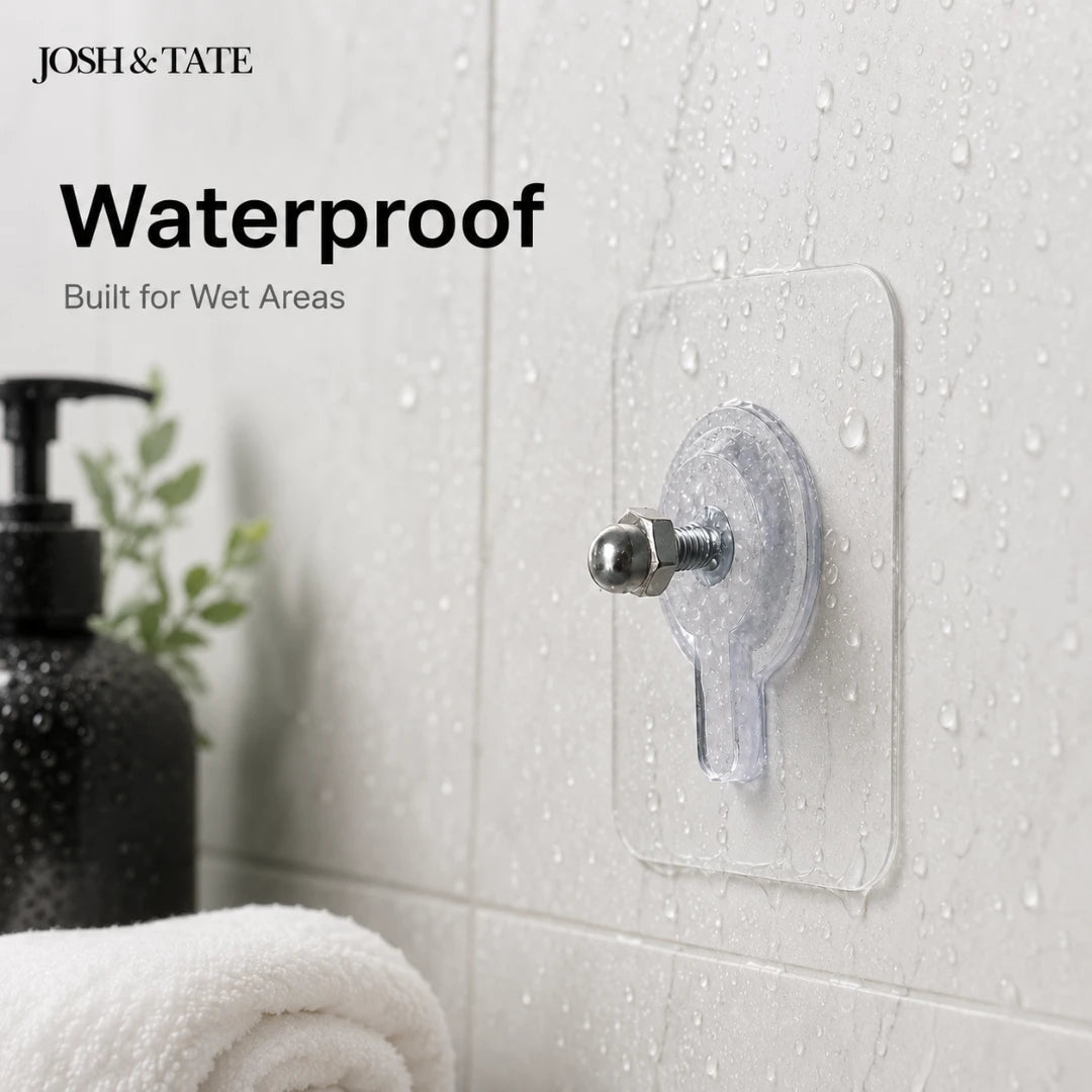Josh & Tate - GripDot™ Adhesive Wall Hook - Transparent adhesive hook on a bathroom wall with 'Josh & Tate' branding and text about waterproof features.