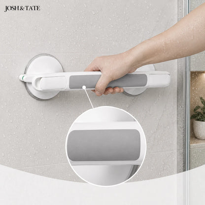 Josh & Tate - GripSafe™ Suction Shower Grab Bar - Hand holding a white grab bar against a textured wall, with 'JOSH & TATE' branding.
