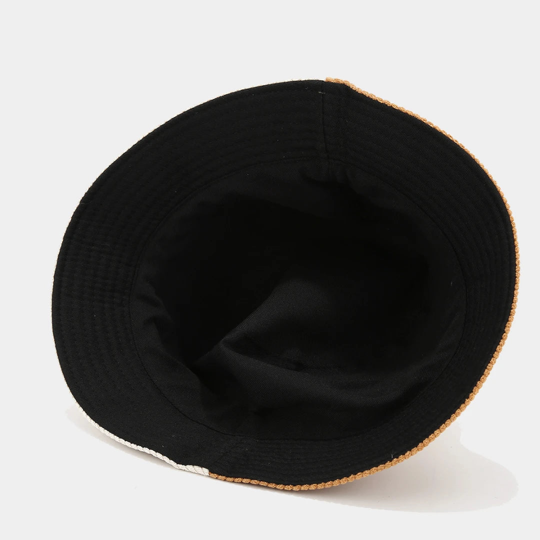 Josh & Tate - HalfTone™ Corduroy Bucket Hat - Black bucket hat with a white rim on a light gray background
