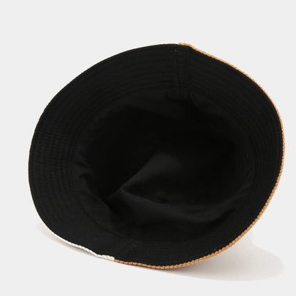 Josh & Tate - HalfTone™ Corduroy Bucket Hat - Black bucket hat with a white rim on a light gray background