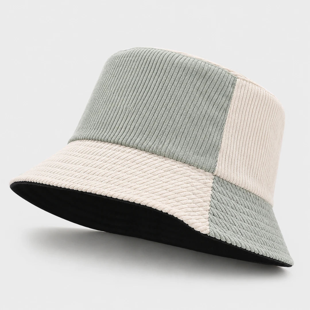 Josh & Tate - HalfTone™ Corduroy Bucket Hat - A patchwork bucket hat featuring a light sage green corduroy crown, a cream woven brim, and a black underside, shown on a light gray background.