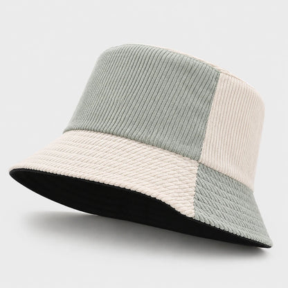 Josh & Tate - HalfTone™ Corduroy Bucket Hat - A patchwork bucket hat featuring a light sage green corduroy crown, a cream woven brim, and a black underside, shown on a light gray background.