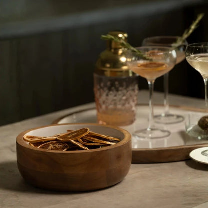 Josh & Tate - Hayes Wooden White Nesting Bowls - Set of 2 - Wooden bowl with dried herbs on a table with cocktails in the background