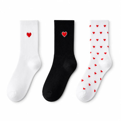 Josh & Tate - HeartStep™ Heart Crew Socks - Three socks with heart designs on a white background