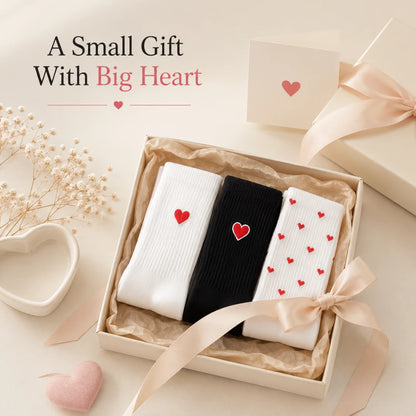 Josh & Tate - HeartStep™ Heart Crew Socks - Three pairs of socks with heart patterns in a gift box on a light background