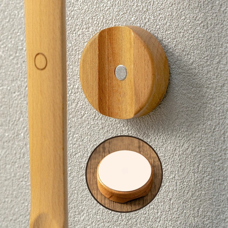 Wooden door handles on a textured wall