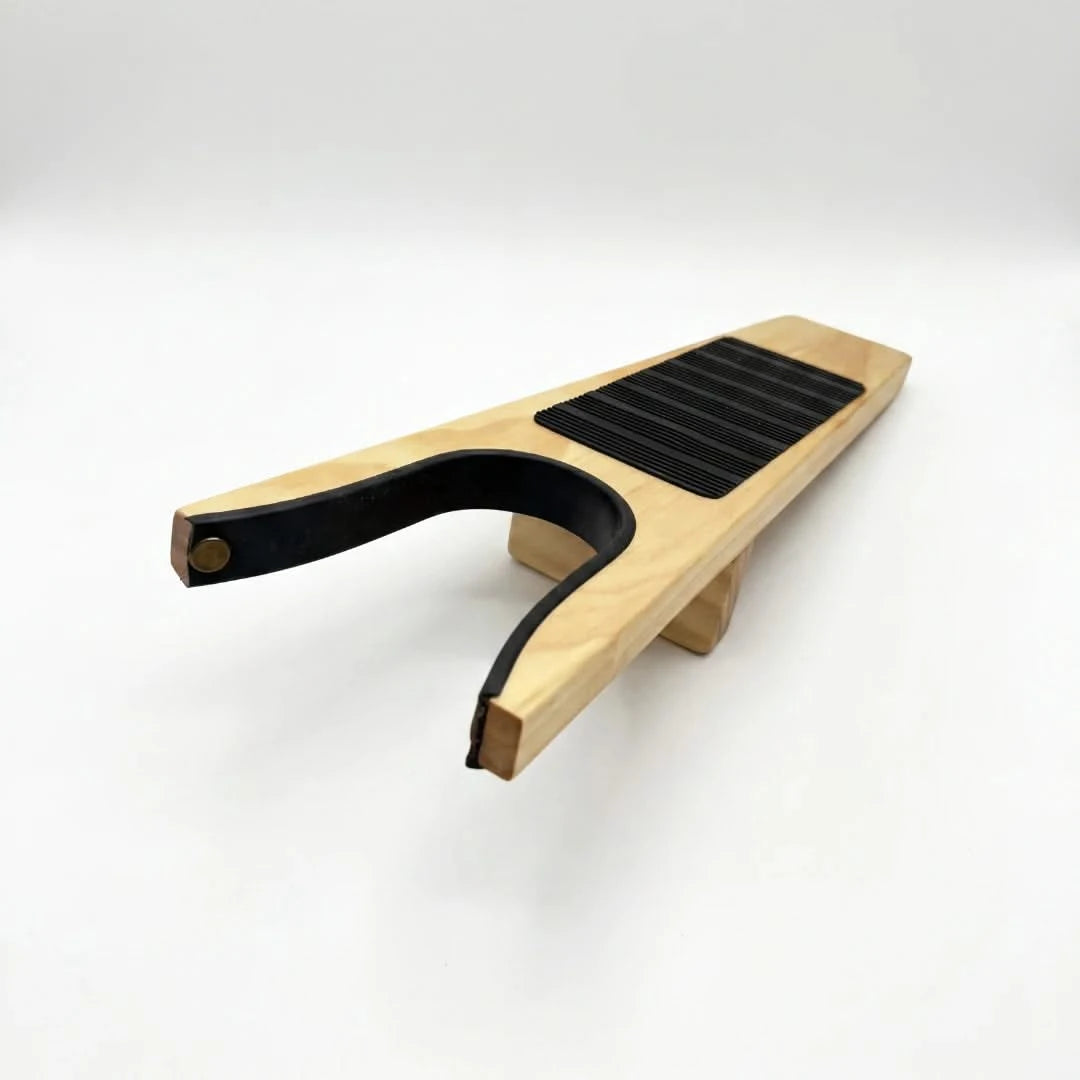 Josh & Tate - HeelHook™ Wooden Boot Jack - Wooden guitar capo on a white background