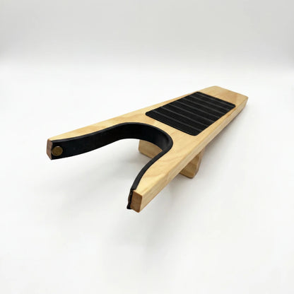 Josh & Tate - HeelHook™ Wooden Boot Jack - Wooden guitar capo on a white background