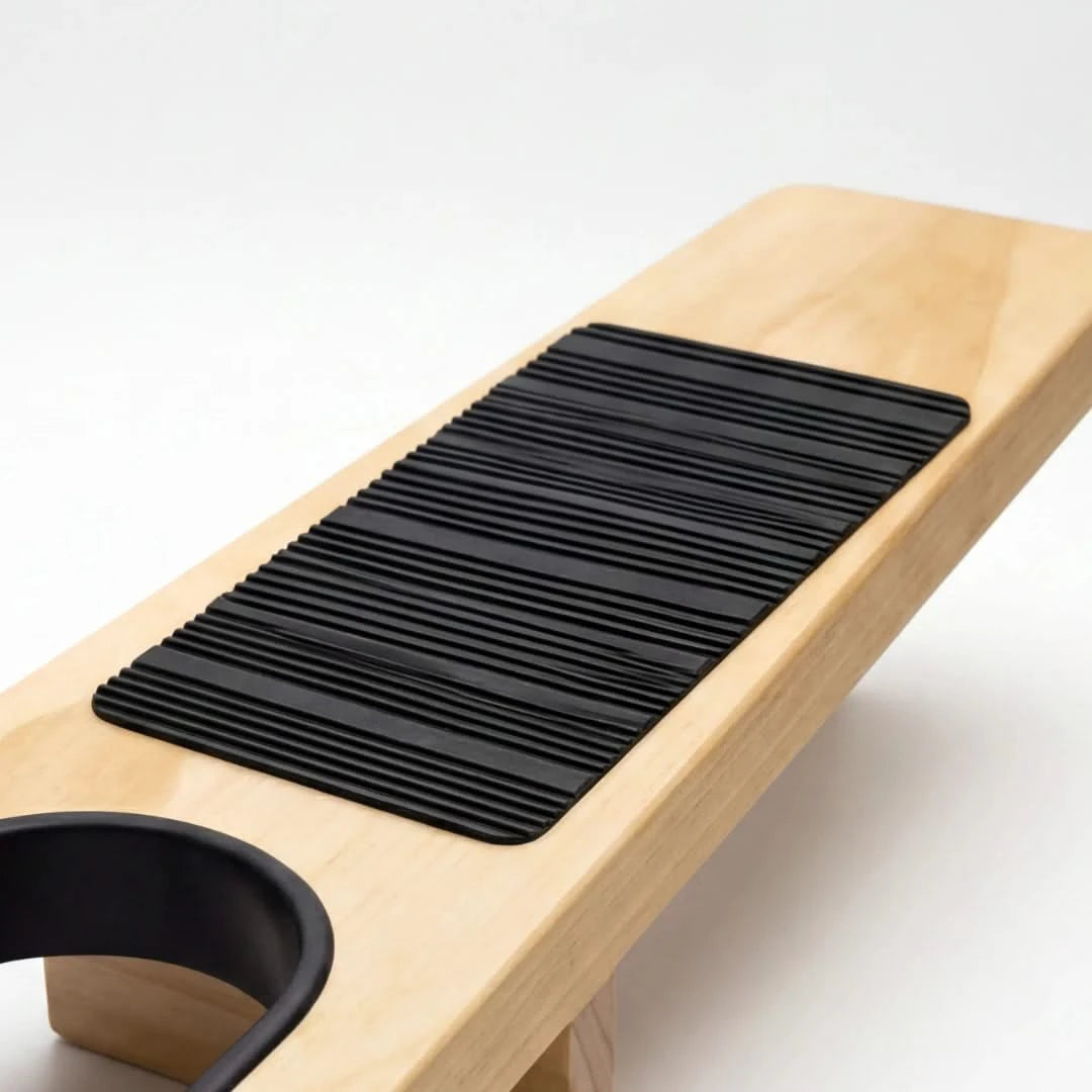 Josh & Tate - HeelHook™ Wooden Boot Jack - Wooden bench with black textured mat and cup holder on a white background
