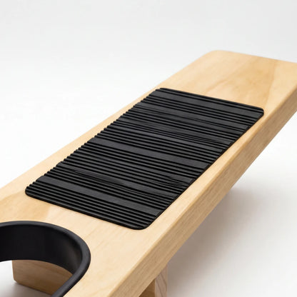 Josh & Tate - HeelHook™ Wooden Boot Jack - Wooden bench with black textured mat and cup holder on a white background