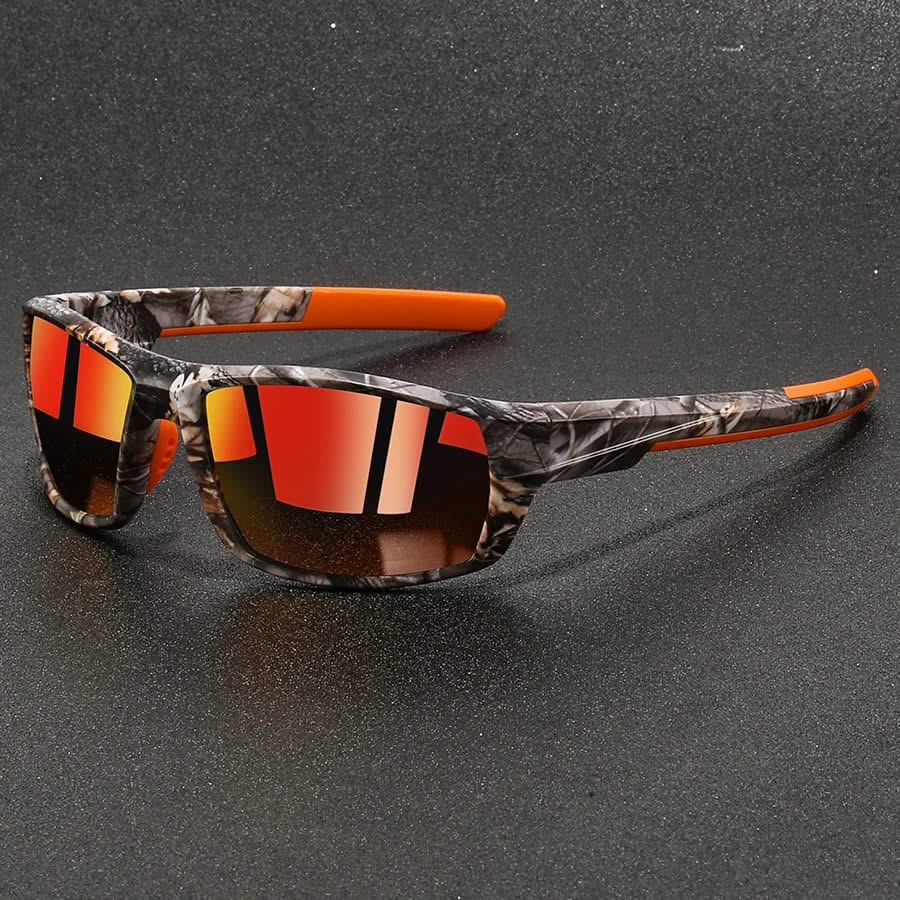 Sunglasses with camouflage frame and orange accents on a dark gray background