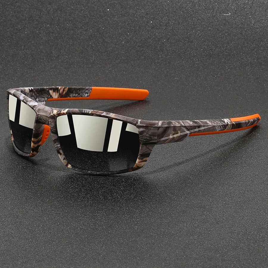 Sunglasses with camouflage frame and orange accents on a gray background