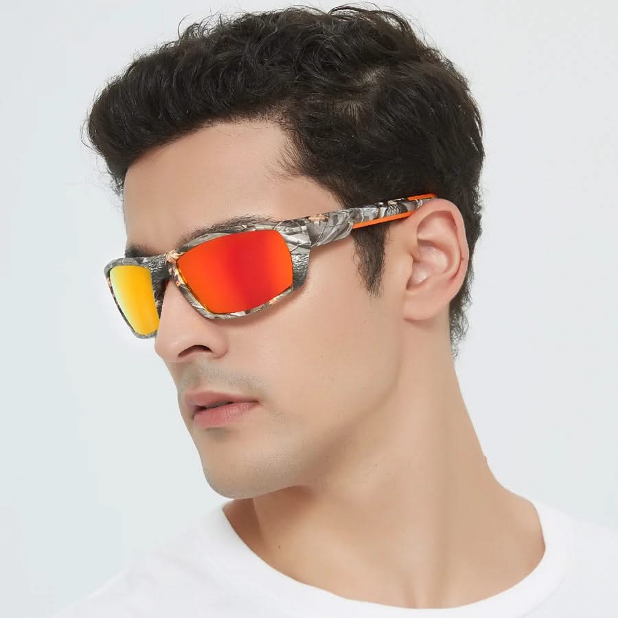 Man wearing a pair of sunglasses with orange lenses and camouflage frame on a white background
