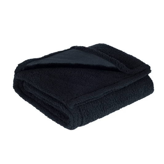 Folded black blanket on a white background