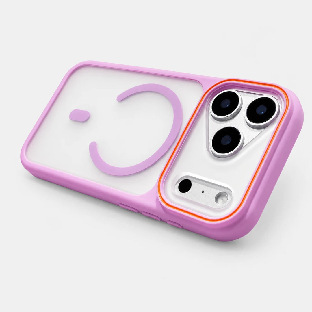 Josh & Tate - JoyRing™ MagSafe iPhone Case - A translucent light purple phone case with a matching purple smiley face design, shown fitted on a white smartphone. The case features a solid purple bumper and camera bezel with a thin orange accent line around the camera cutout.