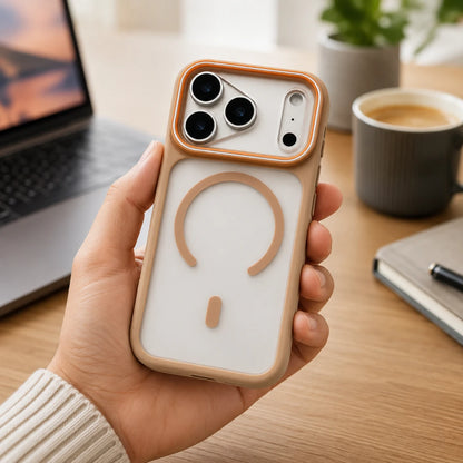 Josh & Tate - JoyRing™ MagSafe iPhone Case - A hand holds a phone case in a warm beige and white color scheme, featuring a circular magnetic design on the back, set against a cozy desk background with a laptop, coffee, and notebook.